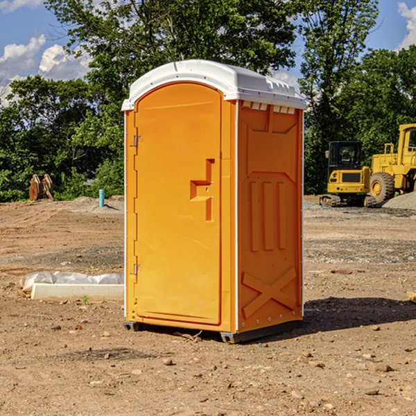 what is the cost difference between standard and deluxe portable restroom rentals in Bigler